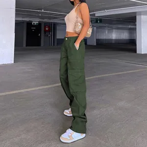 Close-up detail of dark green high waist cargo pants with side pockets and loose fit