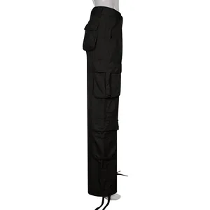 Side view of black high-waist cargo pants with multi-pockets and drawstring hem.