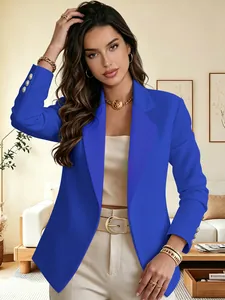 Detailed view of fashionable blue women's suit jacket with elegant gold cuff buttons