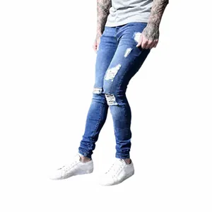 Stylish men's blue distressed skinny denim jeans featuring ripped knees and a faded finish