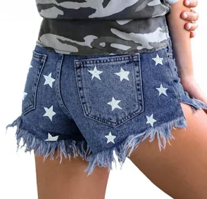 Detailed back view of high-waisted denim shorts with star prints and frayed hems.