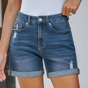 Women's blue distressed denim shorts with rolled cuffs and slim fit design