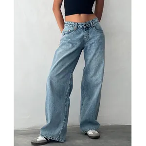 Model wearing vintage light wash low-waist wide-leg jeans with street style sneakers