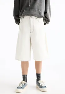 Detailed studio shot of men's white denim knee-length shorts with contrast stitching