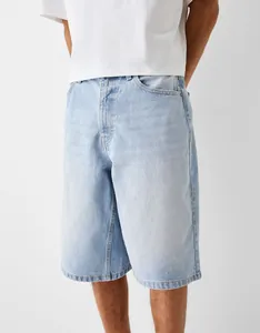 Detailed view of men's light blue washed denim shorts featuring a classic five-pocket design