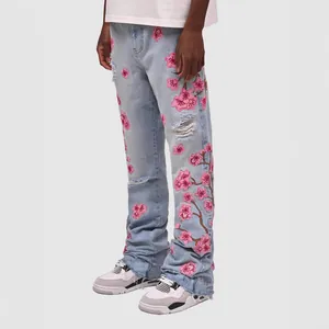 Men's light blue straight-leg jeans with pink cherry blossom embroidery and distressed details