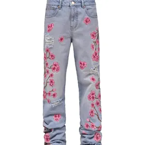 Men's light blue straight-leg jeans with pink cherry blossom embroidery and rips