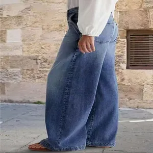 Side view of women's casual wide-leg denim jeans in a washed blue finish.