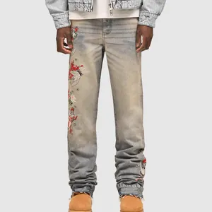 Men's vintage blue straight-leg jeans with detailed floral embroidery and patchwork