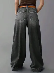 Back view of women's loose wide-leg black denim trousers showing pocket detail