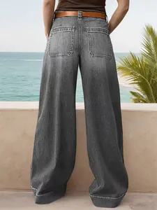 Back view of stylish women's loose wide-leg denim jeans with classic pocket details