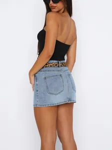 Rear view of a slim fit denim mini skirt with a leopard print belt