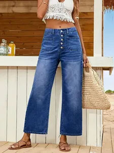 Detail view of women's wide-leg denim jeans with a multi-button fly and patch pockets.