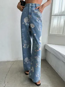 Detailed shot of retro blue floral print high-waist straight-leg denim jeans