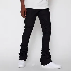 Stylish men's black stacked stretch jeans in urban streetwear fashion style
