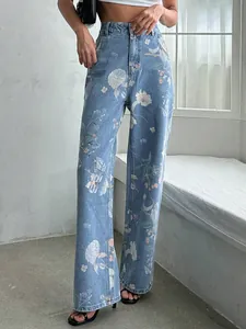Stylish high-waisted wide-leg denim jeans featuring retro blue floral print patterns