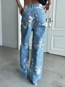 Detailed back view of vintage blue floral print high-waisted wide-leg denim jeans for women