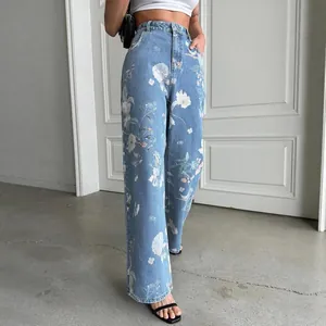Vintage blue high-waisted wide-leg jeans with delicate white floral prints for women