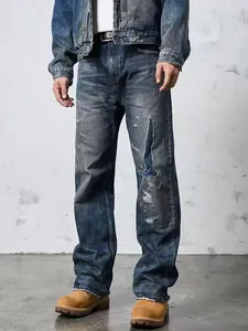Close-up of men's retro distressed straight leg jeans with blue patch detail