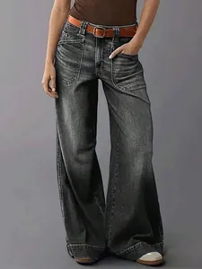 Detail view of women's vintage grey wide-leg high-waisted denim jeans with a loose fit