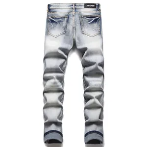 Professional back view of light wash slim fit men's jeans featuring stacked ankle design