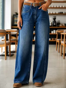 Close-up view of women's high-waisted wide-leg denim jeans with curved seam detail.