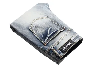Detailed view of light blue washed distressed slim fit stretch denim jeans for men
