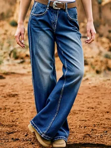 Close-up of women's baggy curved leg denim jeans with a wide-leg straight cut