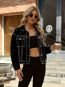 Detailed view of women's black denim jacket featuring silver rivet stud embellishments
