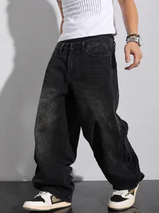 Macro detail of mens baggy plus size wide leg jeans in vintage washed black denim