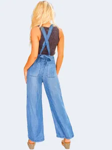 Rear view of women's lightweight Tencel denim overalls with cross-back straps.
