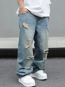 Jeans da uomo larghi stile high street con strappi e gamba dritta in lavaggio azzurro.