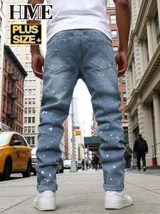Men's plus size light blue jeans with paint splatter details in urban street setting