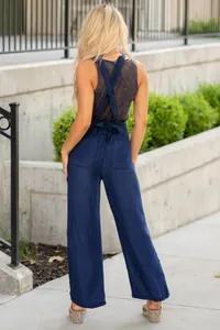 Back view of women's lightweight Tencel wide-leg denim overalls with X-back straps