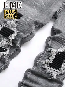 Close-up showing the ribbed patches and distressed details on these grey men's jeans