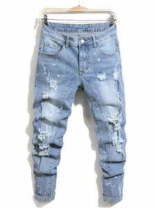 Men's plus size distressed slim fit denim jeans with paint splatter details