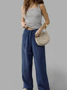 Close-up of women's lightweight blue tencel wide-leg pants with adjustable drawstring