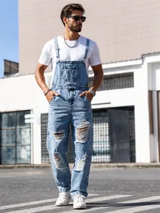 Streetwear distressed denim overalls for men with adjustable straps and ripped knees.