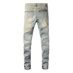 Back view of vintage washed men's straight jeans with paint splatter details
