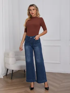 Elegant retro high-waisted wide-leg denim jeans paired with a brown turtleneck top