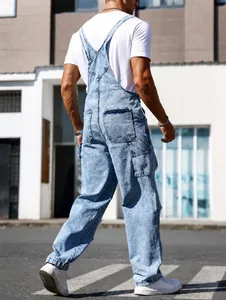 Detailed back view of men's distressed denim overalls featuring a high street wash style