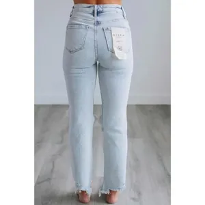 Jean skinny déchiré à taille haute pour femmes en bleu clair délavé, vue de dos.