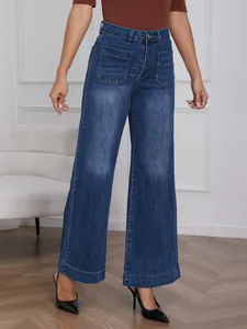 Front view of high-waisted wide-leg jeans in faded blue denim with patch pockets