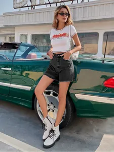 Trendy high-waist loose black denim shorts for women styled in a street fashion look