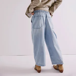 Detailed back view of women's light wash loose drop crotch denim jeans with elastic waist