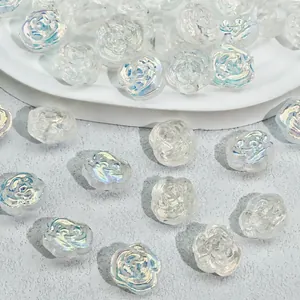 Close-up view of iridescent rose glass beads for DIY jewelry making 12x14x8mm.