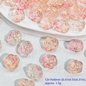 Macro view of delicate pink rose-shaped glass beads for elegant DIY handmade jewelry making