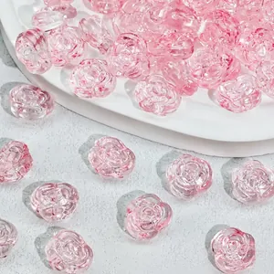 Macro view of pink glass rose beads with 12x14x8mm size and 1.5g weight info.