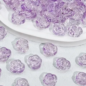Detail macro view showing the intricate petal texture of these purple rose glass beads