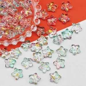 Detail of 14mm star-shaped glass beads with gold foil for DIY jewelry making